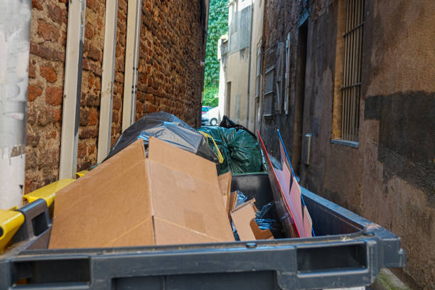 istock trash can in a narrow street 2153896313