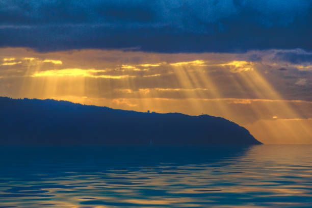 Gold and Blue Sunset with rays over Waimea Bay Oahu