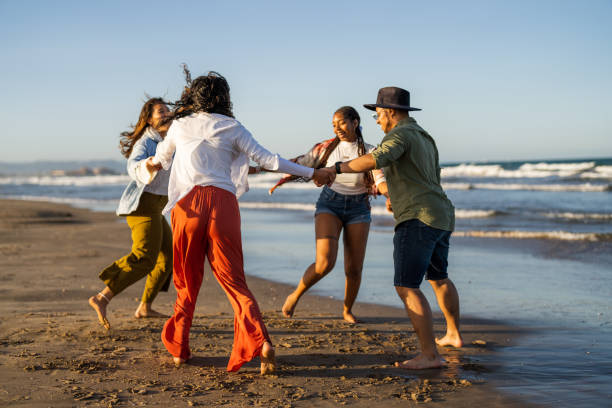 istock Joyful Dance Among Multiethnic Friends on Seaside 2153902340