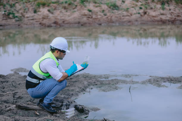 istock Environmental engineers work at wastewater treatment plants,Water supply engineering working at Water recycling plant for reuse 2153907384