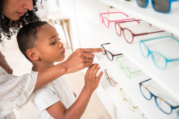 istock Boy's Eyeglass Fitting Session with Expert Optician 2153908107