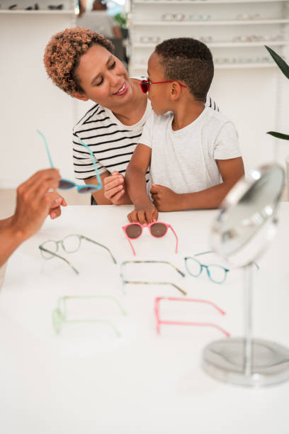 istock Mother and Son Bonding Over Colorful Glasses Selection 2153908124