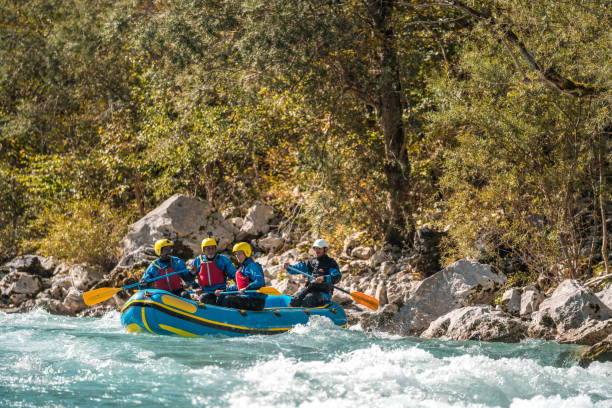 istock Team Rafting in Safety Attire Conquering Rapids 2153908336