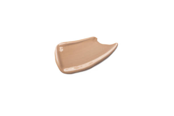 istock Make up smear swatch foundation smudge texture isolated on white background 2153910453