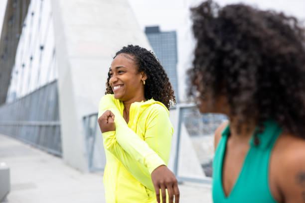 istock Young black girls stretching for a workout 2153911947