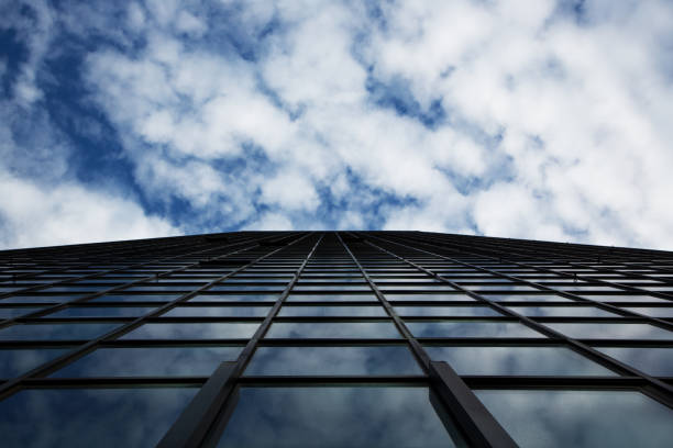 Glass and steel skyscraper reflecting sky