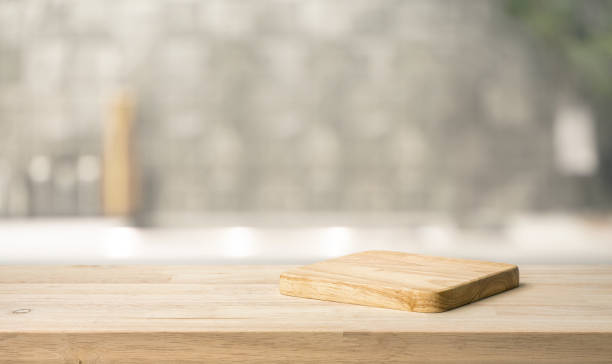 istock Selective focus.End grain wood counter,table top on blur kitchen counter in morning background.For montage product display o 2153914792
