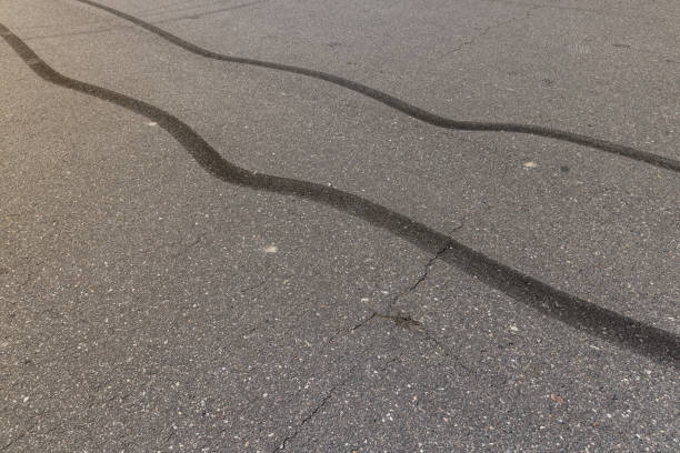 istock tire tracks during dangerous driving on the road 2153915572