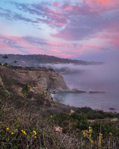 Experience the beauty of Rancho Palos Verdes as a marine layer blankets the coast, creating a mesmerizing cloudscape over rugged cliffs.