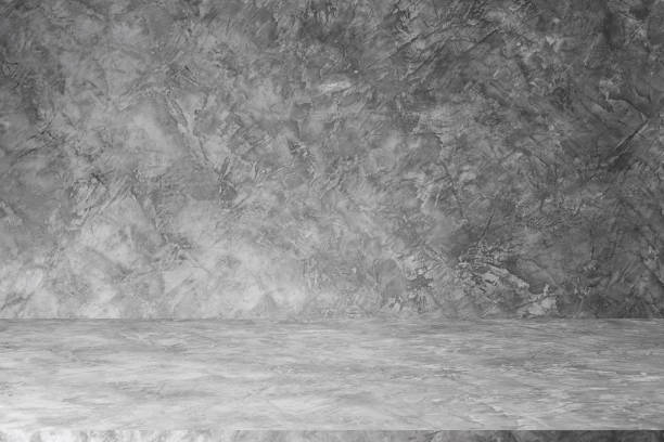 istock Wall empty studio interior background and backdrop of concrete cement wall in black and gray tones. Studio interior background and empty space Decorating ideas 2153917550