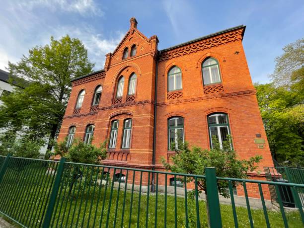 Bohumín, Czech Republic - April 29, 2024: Old well-maintained building surrounded by greenery.