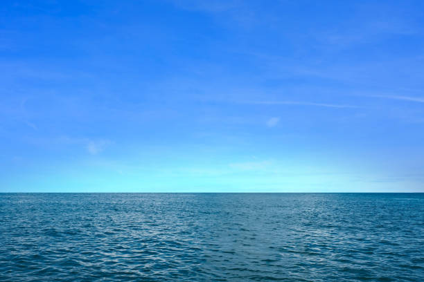istock Background for summer vacation concept. Beach nature and summer seawater with sunlight light sandy beach Sparkling sea water contrast with the blue sky. 2153917921