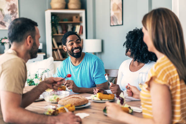 istock Group of friends having meal at home 2153921593