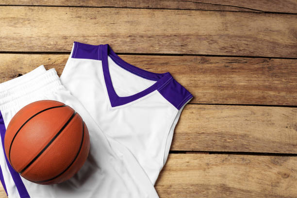 istock Basketball uniform on wooden background top view 2153922242