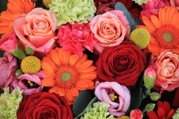 istock orange and red wedding flowers 2153925078