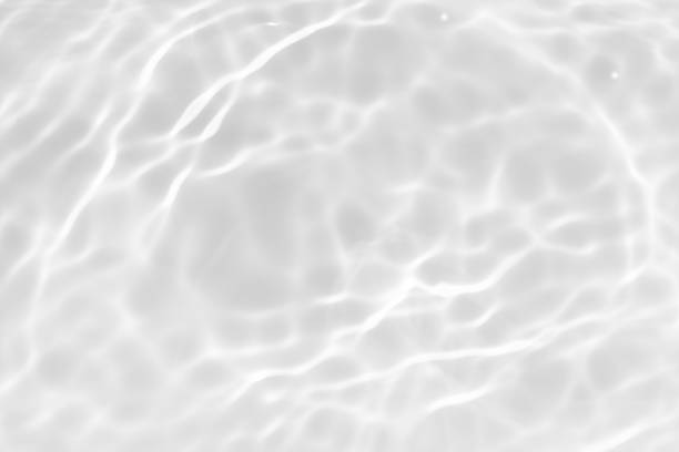 istock Blue water with ripples on the surface. Defocus blurred transparent blue colored clear calm water surface texture with splashes and bubbles. Water waves with shining pattern texture background. 2153927200