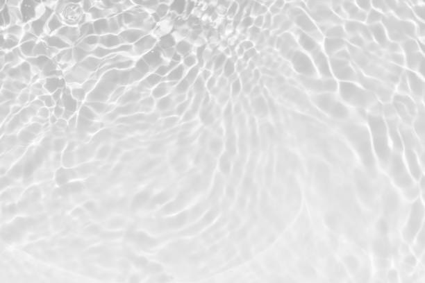 istock Blue water with ripples on the surface. Defocus blurred transparent blue colored clear calm water surface texture with splashes and bubbles. Water waves with shining pattern texture background. 2153927271