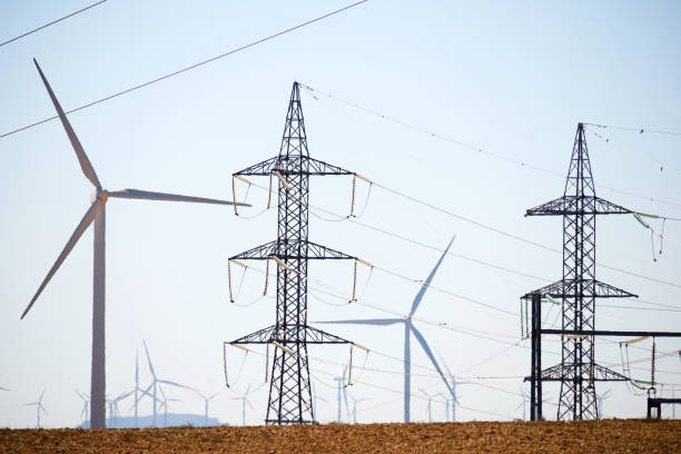 istock Wind turbines and pylons 2153928385