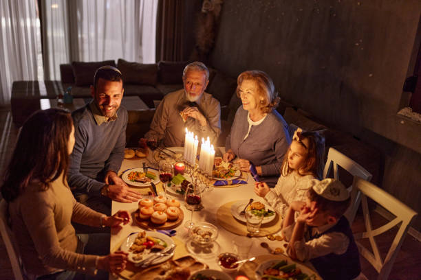 istock Happy multi-generation family talking during dinner on Hanukkah. 2153929191