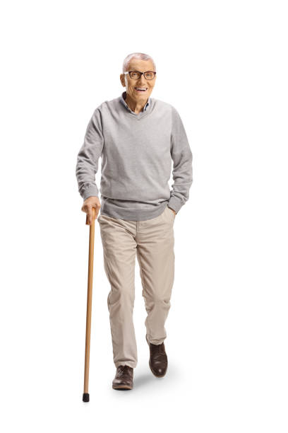 istock Elderly man with a cane walking towards camera 2153929555