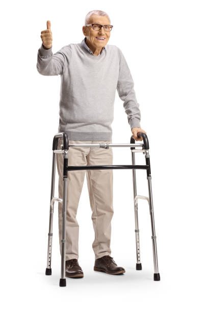 istock Elderly man with a walker showing thumbs up isolated on white background 2153929556