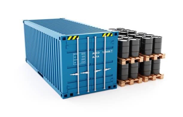 istock Blue shipping container with black fuel barrels 2153929961