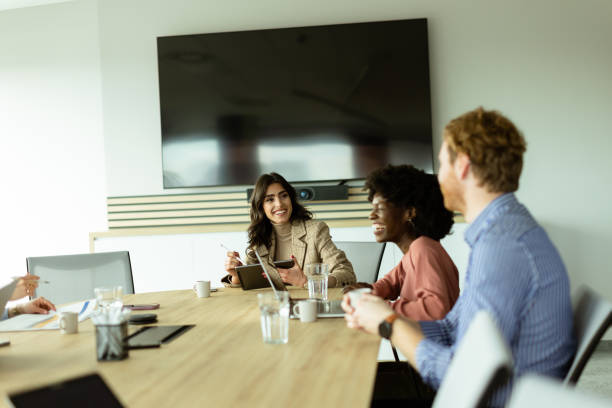istock Diverse team engaging in strategic planning during bright daytime office meeting 2153930225