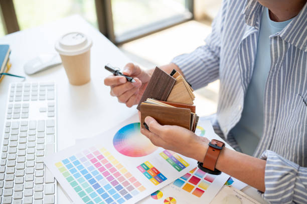 istock A senior Asian male interior designer holding sample swatches, checking the material samples. 2153930562