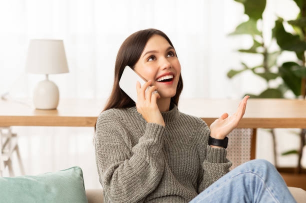 istock Emotional young woman talking on phone and gesturing 2153933270