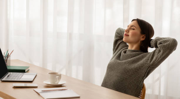 istock Relaxed young woman entrepreneur resting at home office 2153933346