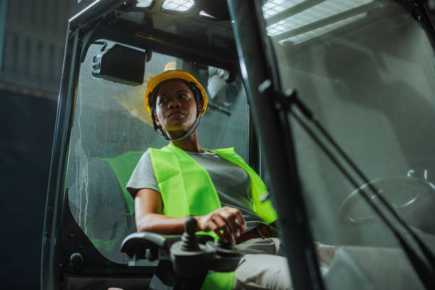 istock Woman driving forklift in a warehouse 2153933502