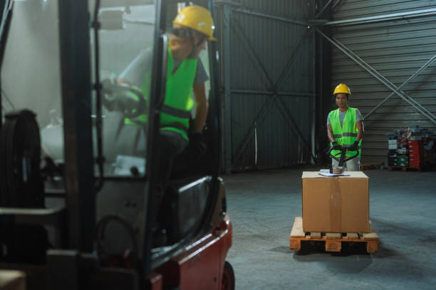 istock Two female employees working in a warehouse 2153933506