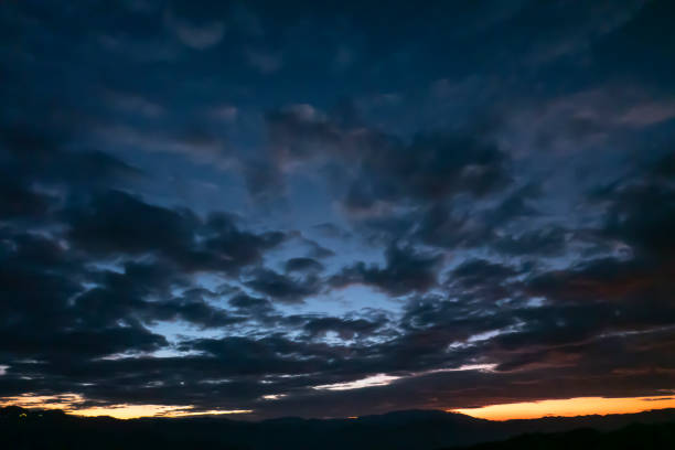 With the sun behind the mountains the colors of the sunset seem painted