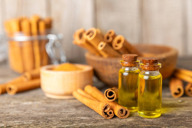 istock Cinnamon aromatic essential oil and cinnamon sticks on background. Aromatherapy. Organic cosmetic oil. Spa concept. Place for text. Copy space. 2153934961