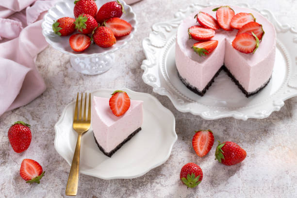 istock No bake cheesecake with fresh strawberries on a light gray table top. Summer dessert. Selective focus. Copy space. 2153935798