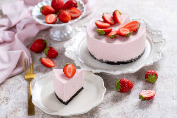 istock No bake cheesecake with fresh strawberries on a light gray table top. Summer dessert. Selective focus. Copy space. 2153935803