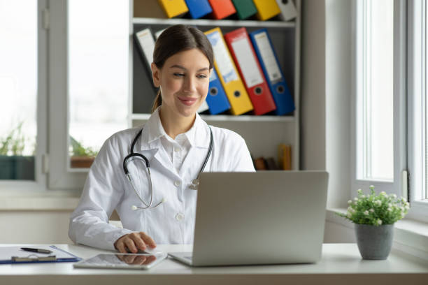 istock Medical practitioner woman working at laptop 2153936920