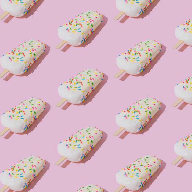 istock Trendy sunlight colorful ice cream popsicle pattern on pastel pink background. Minimal summer concept. Ice cream aesthetic. 2153939046