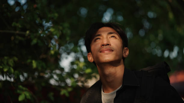 Asian man solo traveling.