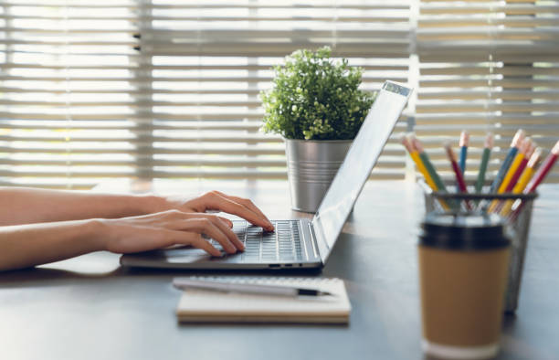 istock Businesswoman working on laptop with type a message on the keyboard. 2153939708