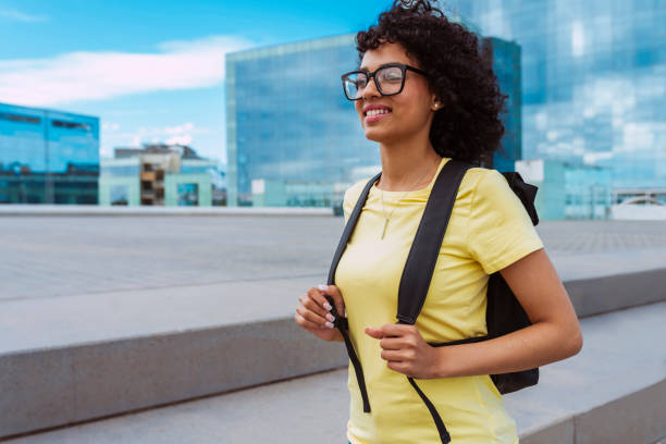istock Young african woman student with backpack 2153941505