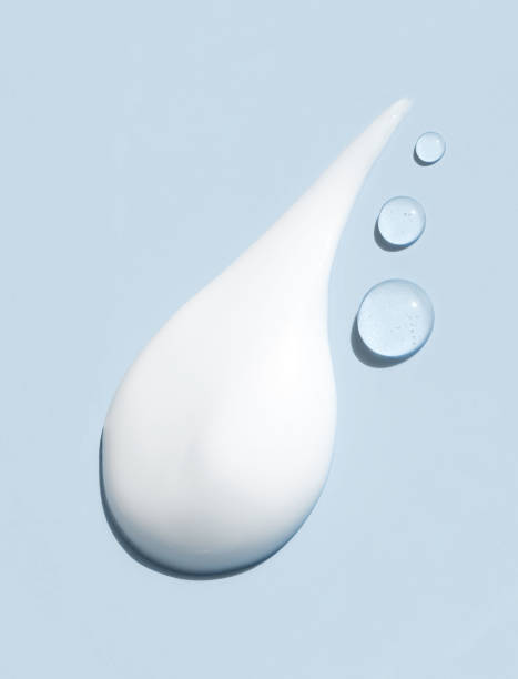 istock cosmetic smear of creamy texture on blue background 2153941685
