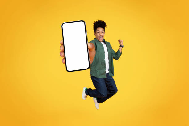 istock Excited young african american guy showing phone with white screen 2153942238