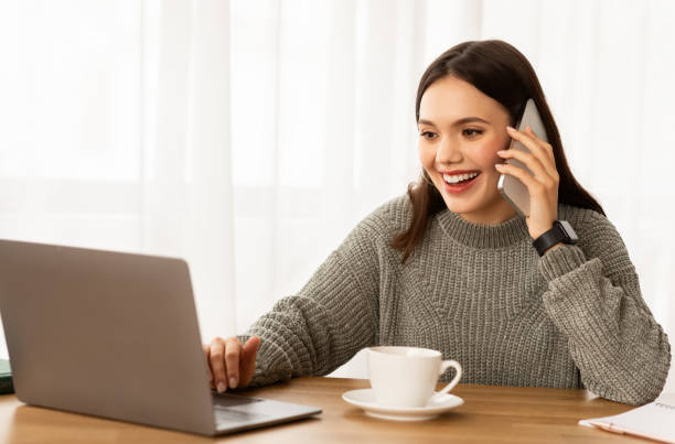 istock Young business lady working from home office, have phone call 2153944244