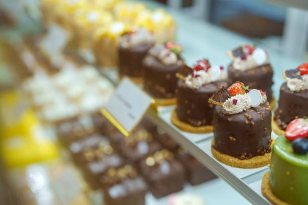istock Cakes and desserts are attractively displayed in a refrigerator in a bakery store, showcasing a variety of delicious options. 2153944268