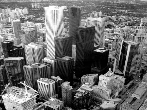 A stunning waterfront view of Toronto’s skyline captured in warm evening light, featuring the CN Tower surrounded by modern skyscrapers and condominiums reflecting on Lake Ontario. This high-resolution image beautifully captures the harmony between urban architecture and nature, making it ideal for travel, tourism, business, and editorial projects highlighting Toronto as a vibrant global city.