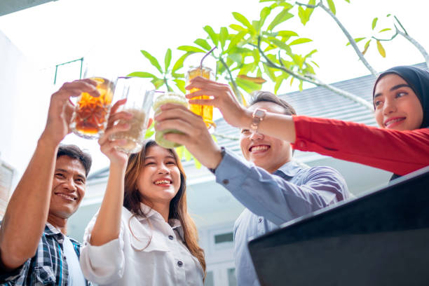 istock Portrait of multiethnic business colleagues toasting during a meeting 2153946708