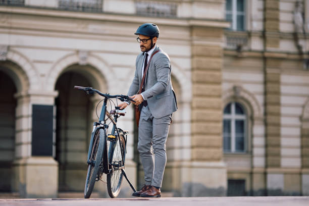 istock Male entrepreneur goin to work with a bicycle. 2153946730