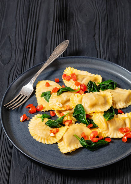 istock italian pasta mezzelune on a plate, top view 2153949713