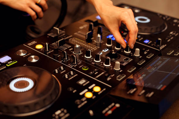 istock Female disc jockey hands mixing tracks 2153949939